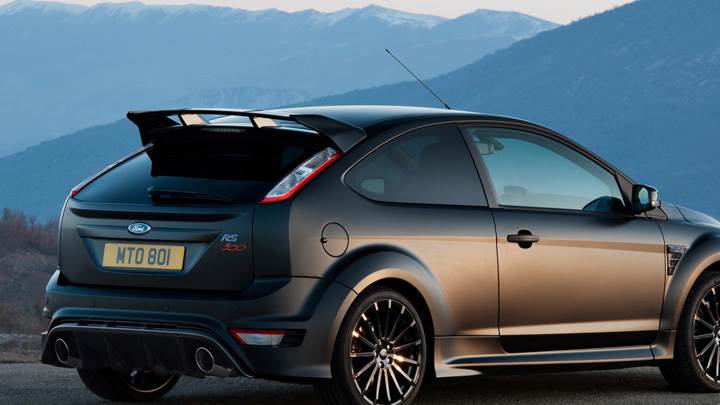 Back Side Pose Of Ford Focus RS500 Near Mountains